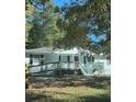 Front view of a white house with a red door and green ramp at 175 Smith Ferguson Rd, Dallas, GA 30157