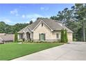 Attractive brick home with manicured lawn and professional landscaping at 1560 Tapestry Rdg, Lawrenceville, GA 30045