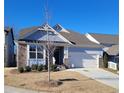 Two-story house with stone accents and a two-car garage at 413 Solace Pl, Canton, GA 30114