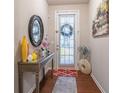 Bright and spacious entryway with decorative console table and mirror at 2354 Attewood Dr, Buford, GA 30519