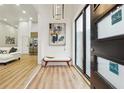 Bright and airy entryway with wood floors and modern art at 1073 Mayson Turner Nw Rd, Atlanta, GA 30314