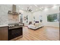 Modern kitchen with stainless steel appliances and marble backsplash at 1073 Mayson Turner Nw Rd, Atlanta, GA 30314