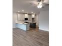 Bright and airy kitchen with hardwood floors, stainless appliances, an island, and white cabinets at 1074 Crest Mill Dr, Marietta, GA 30008
