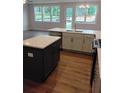 Kitchen with granite countertops, stainless steel dishwasher, and shaker cabinets at 1074 Crest Mill Dr, Marietta, GA 30008