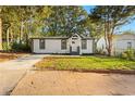 Modern white house with a well-manicured lawn and driveway at 358 Roy Sw St, Atlanta, GA 30310