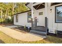 Stylish front entrance with gray steps and a white door at 358 Roy Sw St, Atlanta, GA 30310