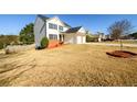 View of home, lawn, and surrounding neighborhood at 1188 Pine Acre Dr, Sugar Hill, GA 30518