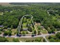 Aerial view of a home and approximate lot lines on a treed 4.3+/- acre lot at 2334 Highway 278, Social Circle, GA 30025
