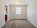 Spacious living room with neutral walls and carpeted floors at 3100 Aberdeen Way, Lithonia, GA 30038