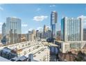 Wide city skyline view from building with modern architecture and blue skies in background at 3325 Piedmont Ne Rd # 1708, Atlanta, GA 30305