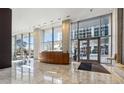 Modern lobby with marble floors, wood reception desk, and ample natural light at 3325 Piedmont Ne Rd # 1708, Atlanta, GA 30305