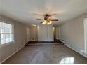 Bright living room with hardwood floors and a ceiling fan at 5090 Great Meadows Rd, Lithonia, GA 30038