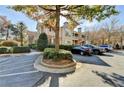 Condominium complex featuring well maintained landscaping and convenient parking at 2400 Cumberland Se Pkwy # 322, Atlanta, GA 30339