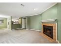 Spacious living room showcases an open floor plan and cozy fireplace feature at 511 Barrington Hills Dr, Atlanta, GA 30350