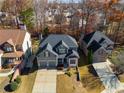 Aerial view of a neighborhood with a gray house in the center at 243 Yorkshire Ln, Villa Rica, GA 30180