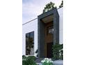 Close-up of a modern entryway with stone accents and minimalist landscaping at 2719 Winding Ne Ln, Brookhaven, GA 30319
