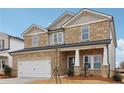 Two-story house with stone accents and a large front yard at 3913 Brushy St, Powder Springs, GA 30127
