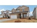 Two-story house with stone accents and a large front yard at 3913 Brushy St, Powder Springs, GA 30127