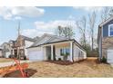 Charming craftsman style home with a two-car garage at 3933 Brushy St, Powder Springs, GA 30127
