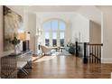 Bright living room with high ceilings, large windows, and elegant decor at 8380 Sentinae Chase Dr, Roswell, GA 30076