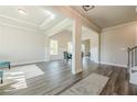 Open-concept living room with hardwood floors and recessed lighting, perfect for entertaining guests at 30 Pinewood Dr, Covington, GA 30014