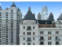 Close-up of The Sterling's architectural details and upper floors featuring balconies and skyline views at 199 14Th St # 3003, Atlanta, GA 30309