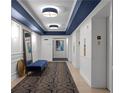 Elegant building hallway features custom lighting, elevator access, and unit entry, creating a welcoming ambiance at 199 14Th St # 3003, Atlanta, GA 30309