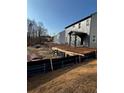 New home construction with a gray exterior and a backyard prepped for new sod at 126 Henley St, Canton, GA 30114