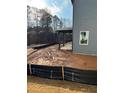 New construction showing the backyard of a home with erosion control barriers in place at 126 Henley St, Canton, GA 30114