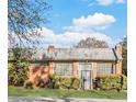 Brick building with large windows and metal roof at 1112 Delaware Se Ave, Atlanta, GA 30316