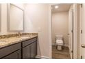 Bathroom features granite counters, double sinks and toilet room with a new toilet at 311 Bianca Way, Mcdonough, GA 30253