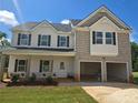 New two-story home with a two-car garage, set on a sunny lot at 1637 Fuma Leaf Way, Mcdonough, GA 30253