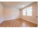 Bright bedroom with hardwood floors and two windows providing natural light at 138 Henley St, Canton, GA 30114