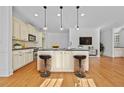 Modern kitchen with island, stainless steel appliances, and hardwood floors at 2260 Edgartown Se Ln # 1, Smyrna, GA 30080
