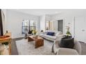 Bright living room with a modern design, large windows, and comfortable seating arrangement at 966 Moda Dr, Atlanta, GA 30316