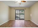 Living room with sliding doors to patio and wood floors at 43 Basswood Cir, Atlanta, GA 30328