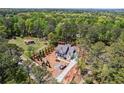 An aerial view shows this house with a wooded lot at 10350 Alvin Road, Alpharetta, GA 30022