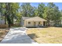 Newly built home with a driveway and mature trees at 1363 Diamond Se Ave, Atlanta, GA 30316