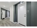 Hallway with modern gray and white walls and gray floors with unit 403 at 788 W Marietta Nw St # 403, Atlanta, GA 30318