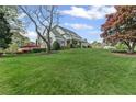 Expansive green lawn and landscaping surround this beautiful two-story home at 710 Cox Rd, Roswell, GA 30075