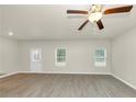 Spacious living room with wood-look floors and neutral walls at 527 Firethorn Ct, Villa Rica, GA 30180