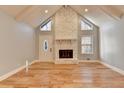 Spacious living room with hardwood floors, fireplace and vaulted ceiling at 1695 Bull Sw Run, Lilburn, GA 30047