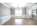 Bright dining room with hardwood floors and chandelier at 1444 Tether Ln, Mcdonough, GA 30253