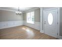 Bright dining room with hardwood floors and chandelier at 1444 Tether Ln, Mcdonough, GA 30253