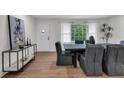 Modern dining room with a sleek table and hardwood floors at 2873 Bob Bettis Rd, Marietta, GA 30066