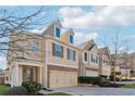 Townhome community featuring multiple two-story homes with similar design and landscaping at 7633 Summer Berry Ln, Lithonia, GA 30038