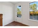 Bright entryway with a white door, hardwood floors, and a large window view at 3879 Allegretto Cir # 116, Atlanta, GA 30339