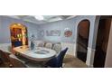 Elegant dining room with oval table, chandelier, and neutral colors at 870 Belmar Pass, Fairburn, GA 30213