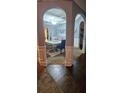 View of the dining room through arched hallways at 870 Belmar Pass, Fairburn, GA 30213