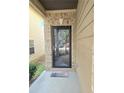 Modern black front door with glass panels and a welcome mat at 5901 Seabright Ln, Atlanta, GA 30349